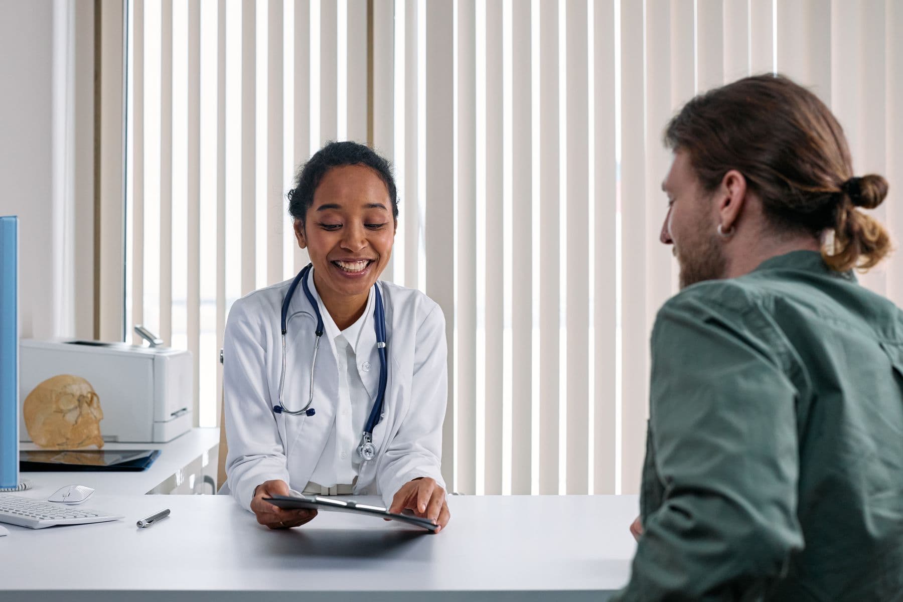 General physician consultation room with clinical notes and patient-first care setup